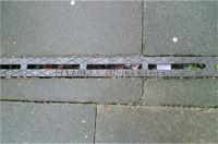 Channel with Slit Scored X Pattern Raised Lettering below  EXETER