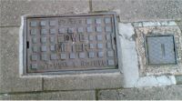 Cover, East Devon Water Board Meter, Upside down writing