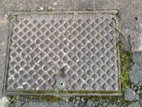 Manhole Diamond Pattern Hinged, Name on Edge FALMOUTH